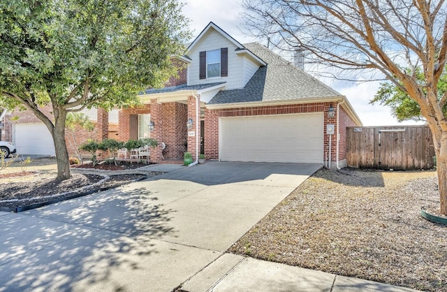 traditional home with a garage, brick siding, a shingled roof, fence, and driveway