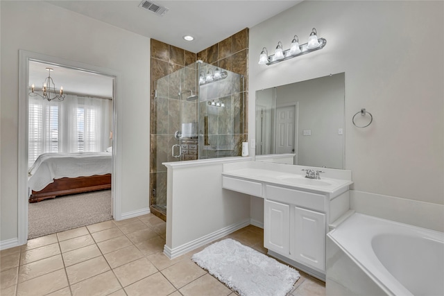 ensuite bathroom with visible vents, ensuite bath, tile patterned floors, vanity, and a shower stall