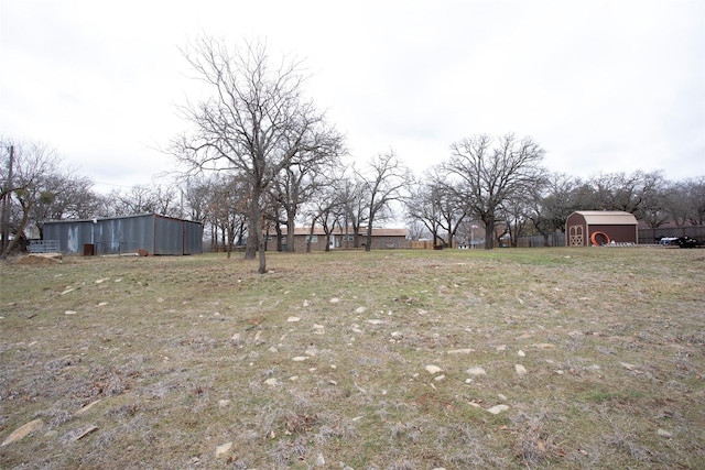 view of yard with an outbuilding and a pole building