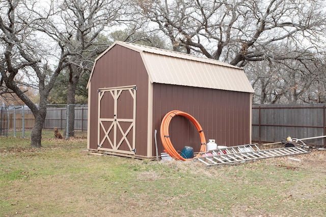 view of shed featuring a fenced backyard