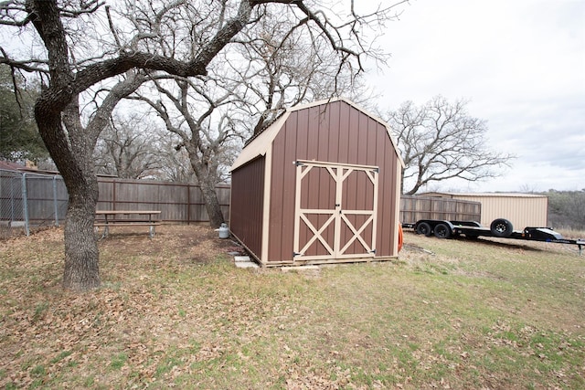 view of shed with fence