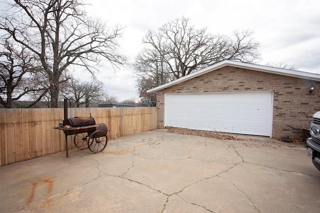 garage with fence