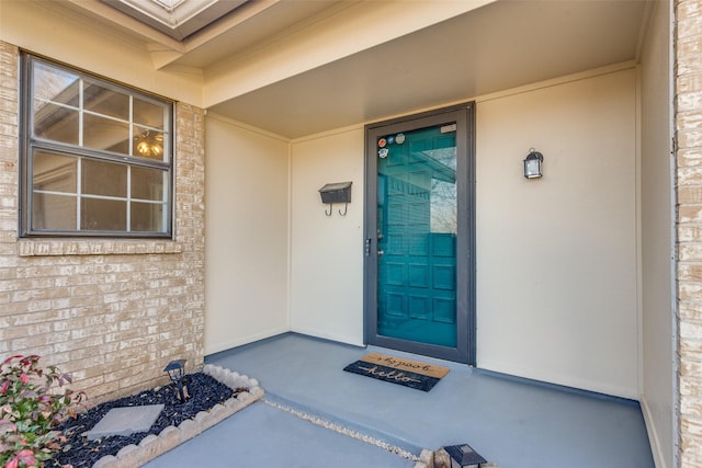 property entrance with brick siding