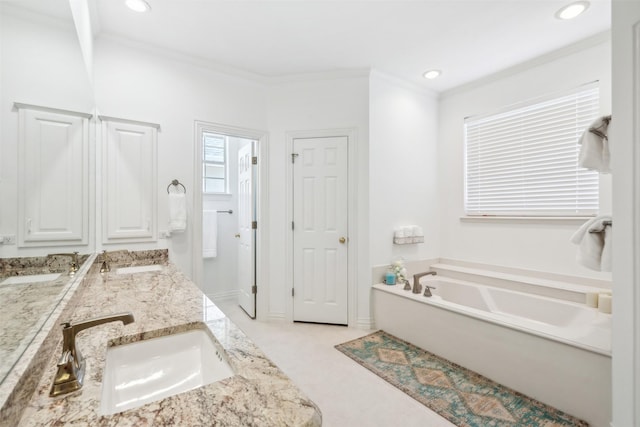 bathroom featuring crown molding, double vanity, a sink, and a bath