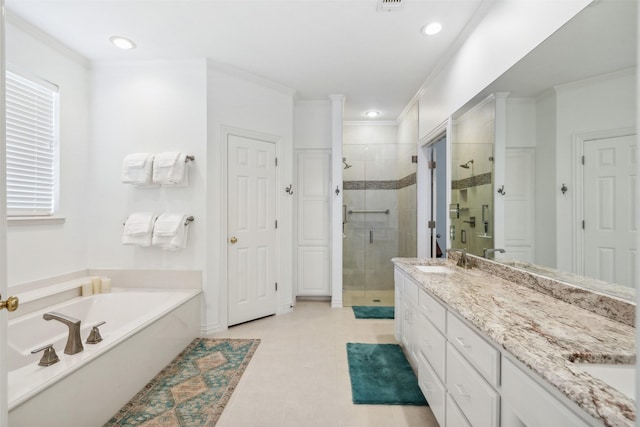 full bath featuring double vanity, ornamental molding, a sink, a shower stall, and a bath