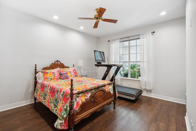 bedroom with recessed lighting, wood finished floors, and baseboards