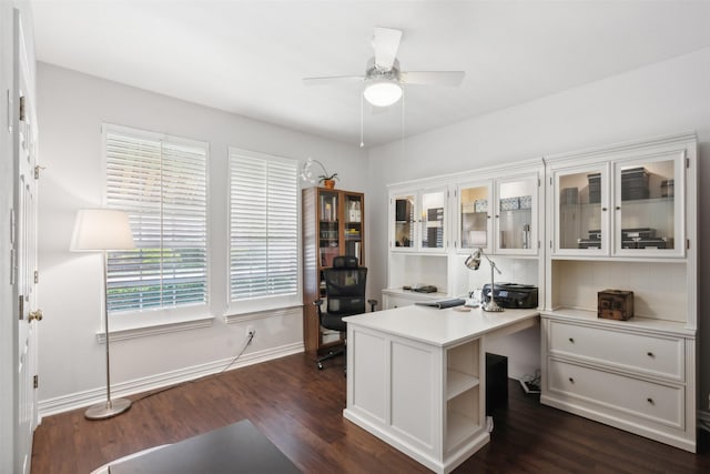 home office featuring dark wood-style floors, baseboards, and a ceiling fan