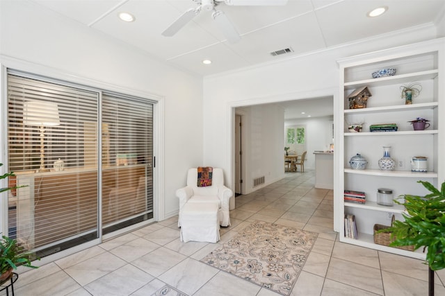 living area featuring light tile patterned floors, visible vents, a ceiling fan, and recessed lighting