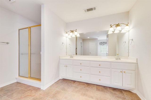 full bathroom with a sink, double vanity, a shower stall, and visible vents