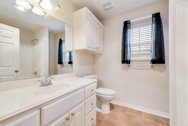 full bath featuring visible vents, baseboards, toilet, walk in shower, and vanity