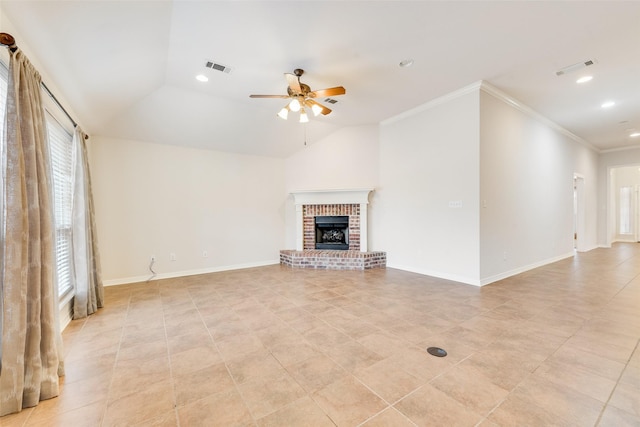 unfurnished living room featuring a ceiling fan, lofted ceiling, a brick fireplace, and crown molding