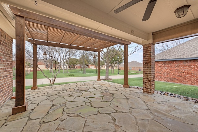 view of patio / terrace with ceiling fan and a pergola