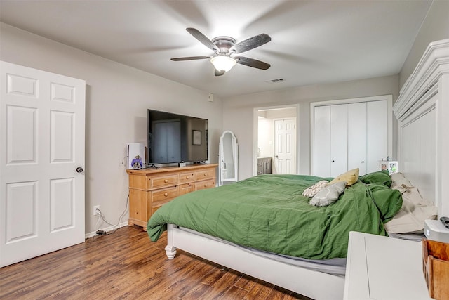 bedroom with visible vents, ceiling fan, connected bathroom, wood finished floors, and baseboards