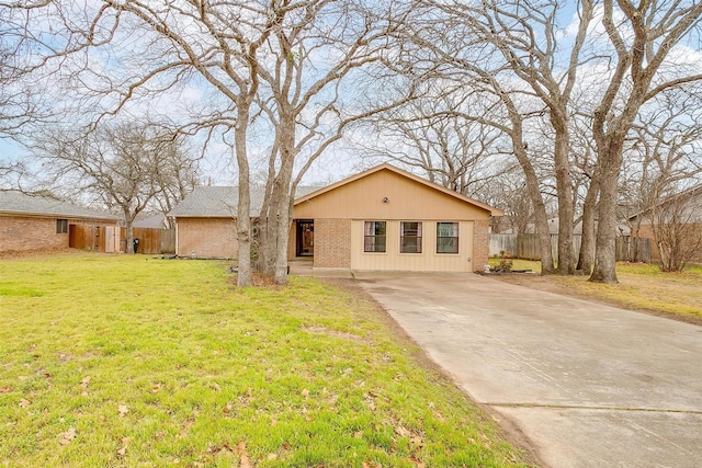 816 Lake Crest Pkwy, Azle, TX 76020 - view of front of home featuring brick siding, a front yard, concrete driveway, and fence