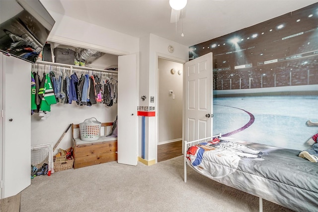 bedroom with carpet and a closet