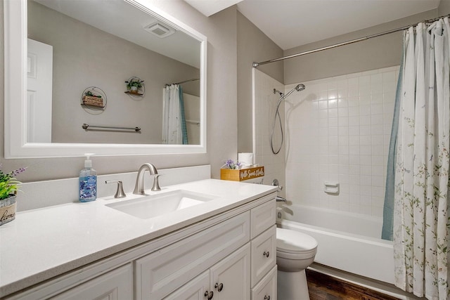 full bath with toilet, wood finished floors, vanity, visible vents, and shower / tub combo with curtain