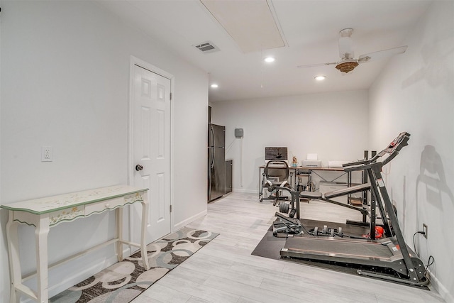 workout area with recessed lighting, visible vents, baseboards, light wood finished floors, and attic access