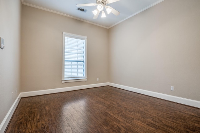 empty room featuring dark wood-style floors, crown molding, visible vents, ceiling fan, and baseboards