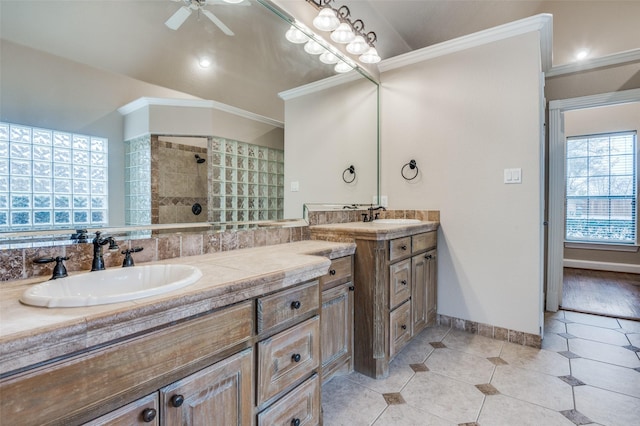 bathroom with double vanity, ornamental molding, a sink, and tile patterned floors