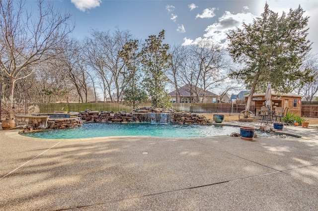 view of swimming pool with an in ground hot tub, a patio area, a fenced backyard, and a fenced in pool