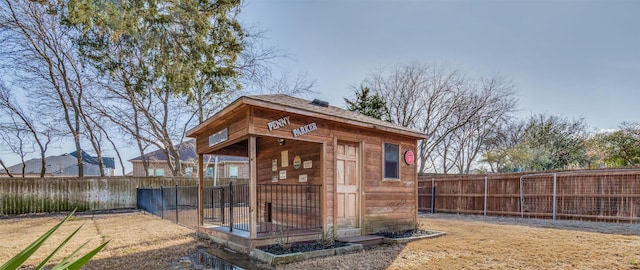 view of outbuilding with an outbuilding and a fenced backyard