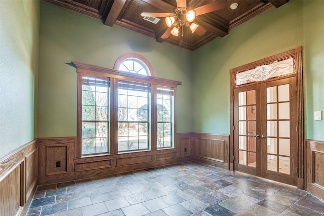 interior space with coffered ceiling, french doors, visible vents, and beam ceiling