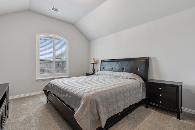 carpeted bedroom with baseboards, visible vents, and vaulted ceiling