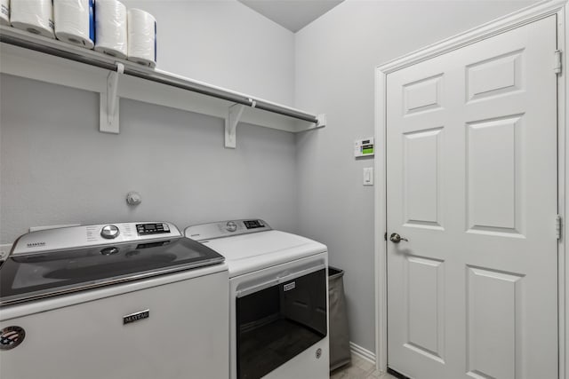 laundry room with washing machine and dryer and laundry area