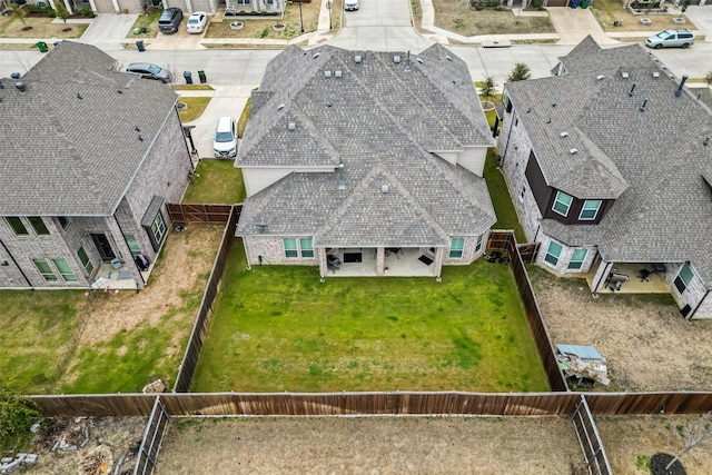 birds eye view of property with a residential view