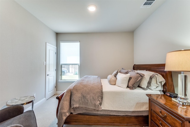 bedroom with carpet, visible vents, and baseboards