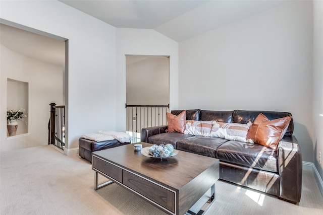 living area featuring carpet floors, lofted ceiling, and baseboards