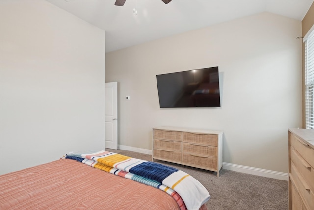 bedroom with ceiling fan, baseboards, vaulted ceiling, and light colored carpet