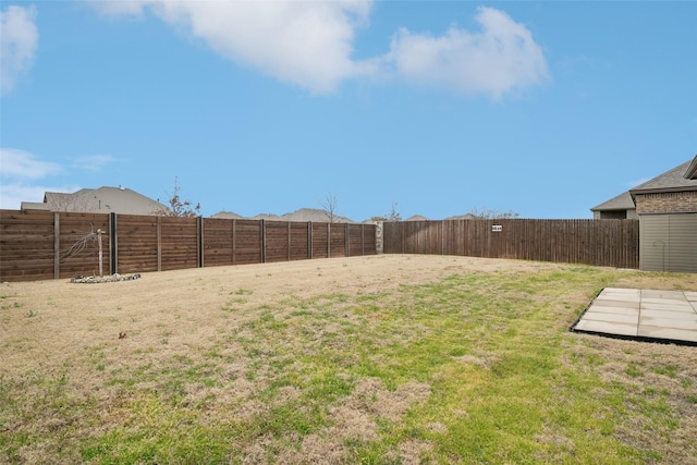 view of yard with a fenced backyard