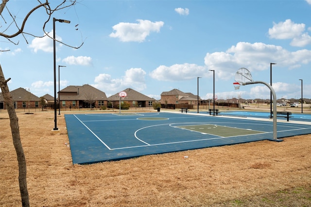 view of sport court featuring community basketball court and fence