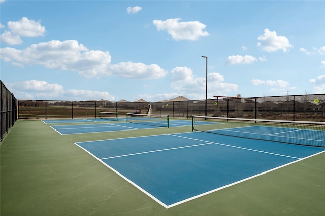 view of sport court with fence