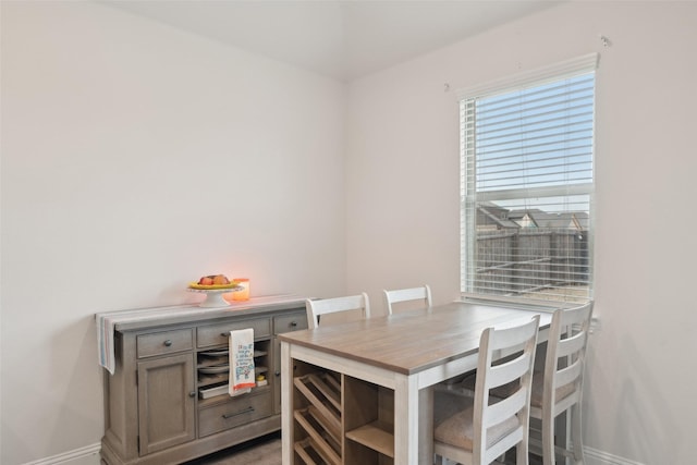 dining space featuring baseboards