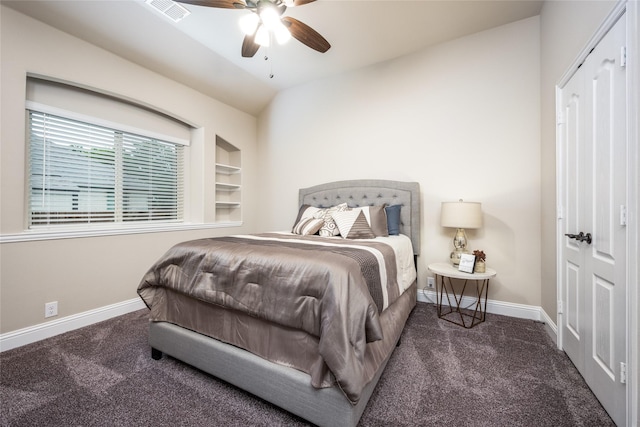 carpeted bedroom featuring visible vents, vaulted ceiling, baseboards, and ceiling fan