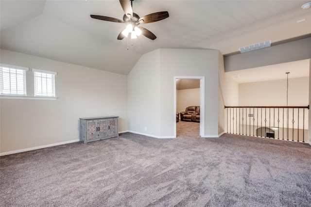 bonus room with carpet floors, visible vents, vaulted ceiling, and a ceiling fan