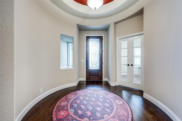 entryway featuring french doors, wood-type flooring, and baseboards