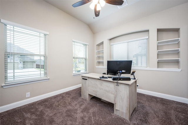 office area with visible vents, baseboards, vaulted ceiling, built in features, and dark colored carpet