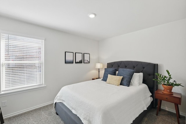 bedroom featuring carpet floors and baseboards