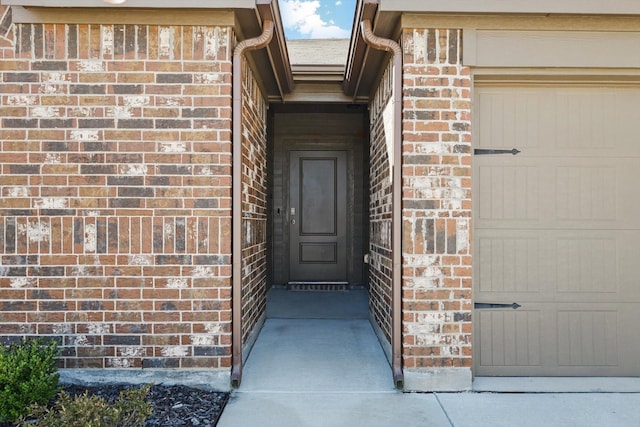 entrance to property with brick siding