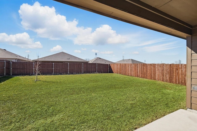 view of yard featuring a fenced backyard