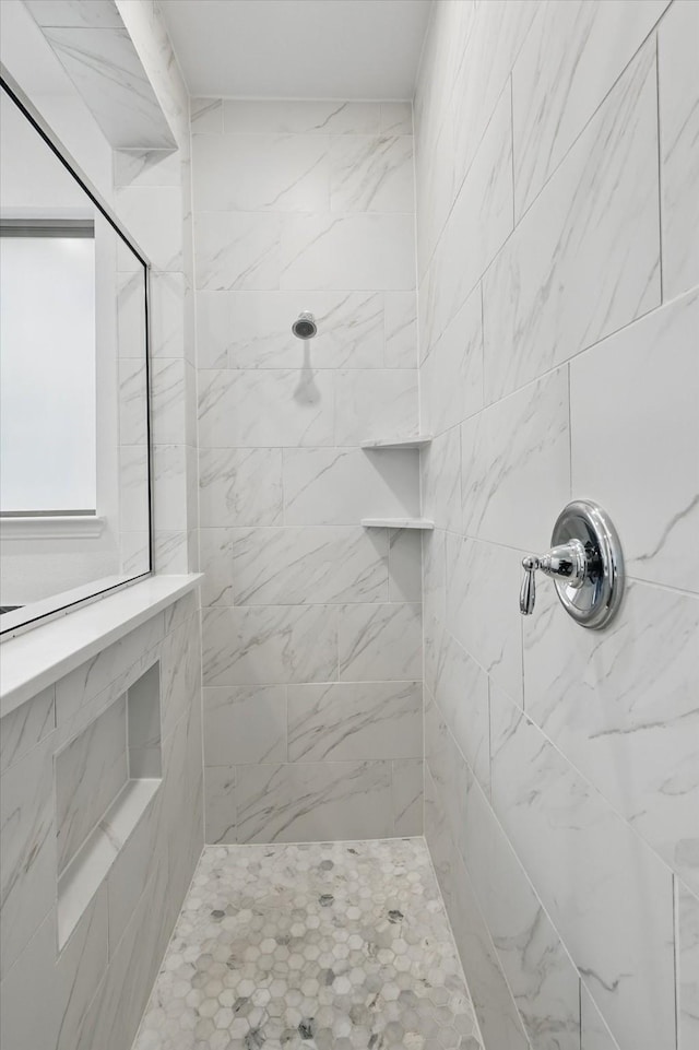 bathroom featuring tiled shower