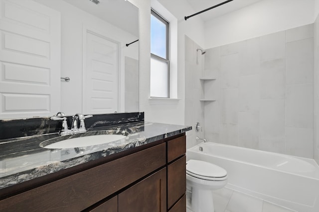 bathroom with tub / shower combination, vanity, toilet, and tile patterned floors