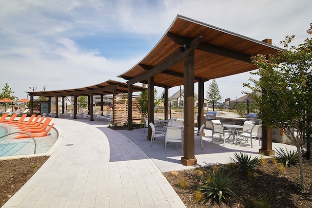 surrounding community featuring a patio