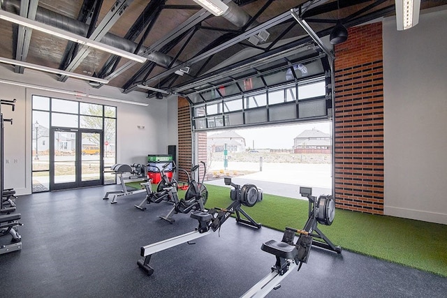 exercise room featuring french doors and baseboards