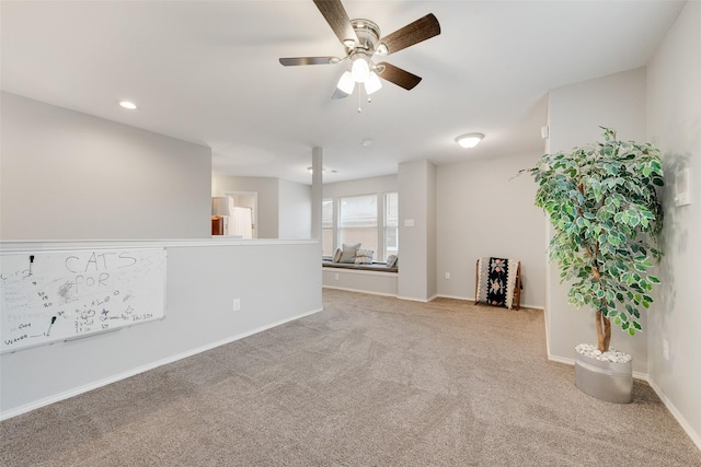 spare room with ceiling fan, recessed lighting, carpet, and baseboards