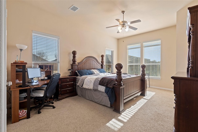 carpeted bedroom with visible vents, ceiling fan, and baseboards