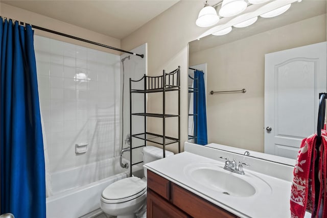 bathroom with shower / bathtub combination with curtain, toilet, and vanity